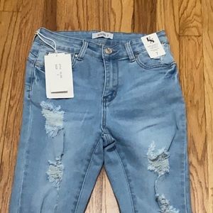 Blue ripped skinny jeans